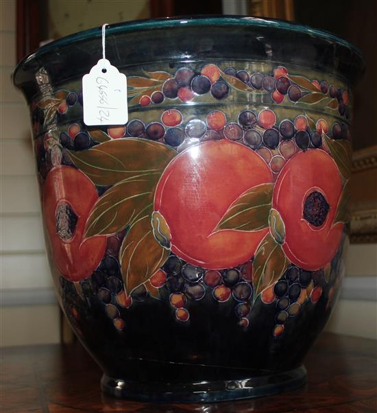 A large William Moorcroft pomegranate pattern jardiniere, dated 1919, 31.5 x 36cm, damage